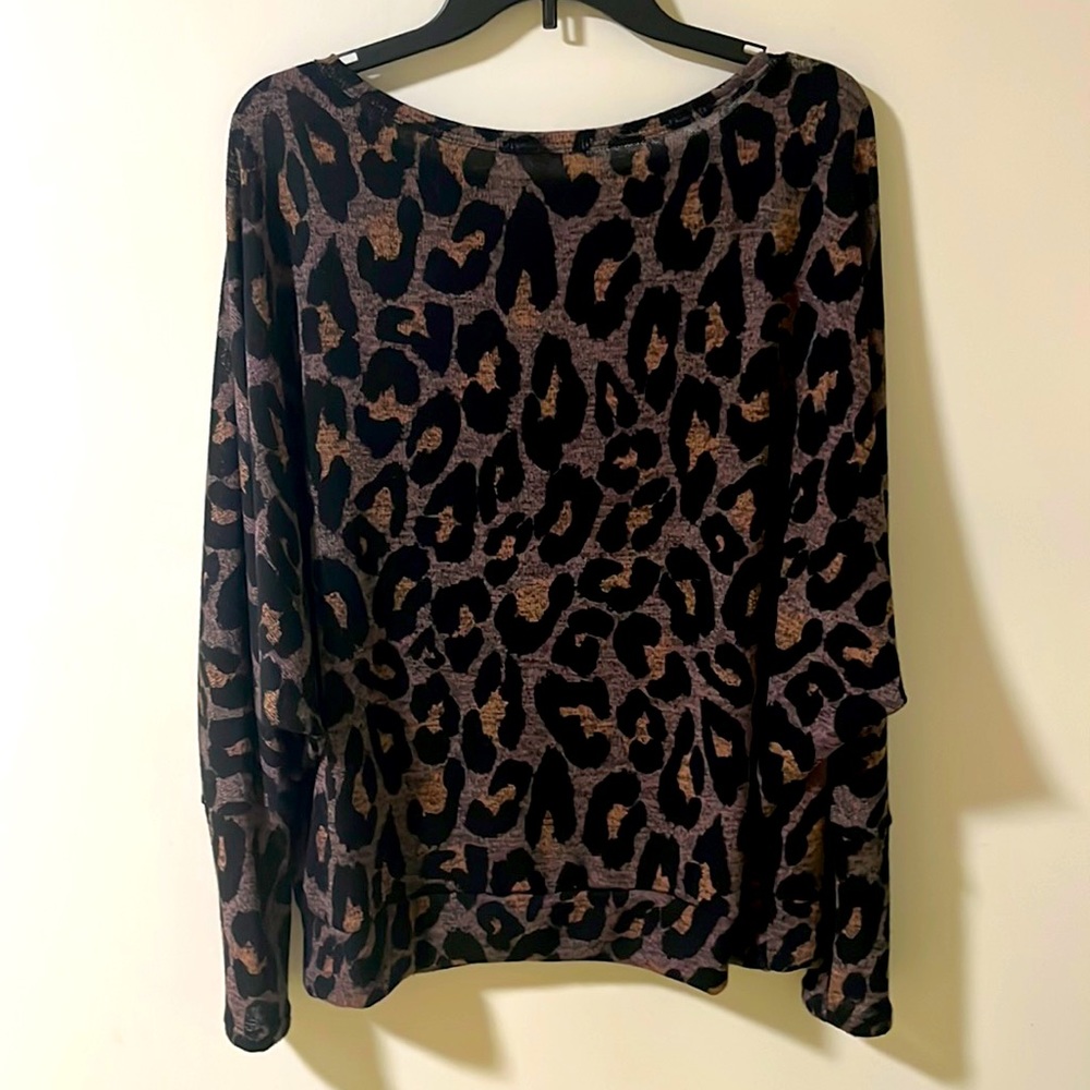 Medium, lightweight sweater. Purchased from Kaley Jase Boutique.